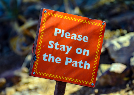 please stay on the path sign
